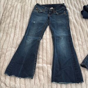 Medium to Dark Blue Flare Wide Leg Jeans with Raw Hem and Vintage Look